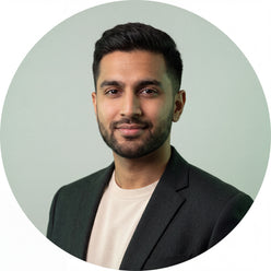 Circular portrait of Arjun Sethi, a professional South Asian man, smiling confidently against a clean background.