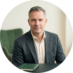 Portrait of Klaus Weber, a man with short hair and smart casual attire, looking confidently at the viewer.