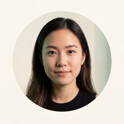 Circular portrait of Jessica Low, a young woman, looking confidently at the viewer against a clean, warm cream background.